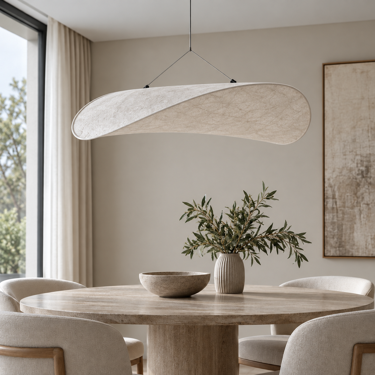 Onda pendant above a stone dining table in a softly lit interior