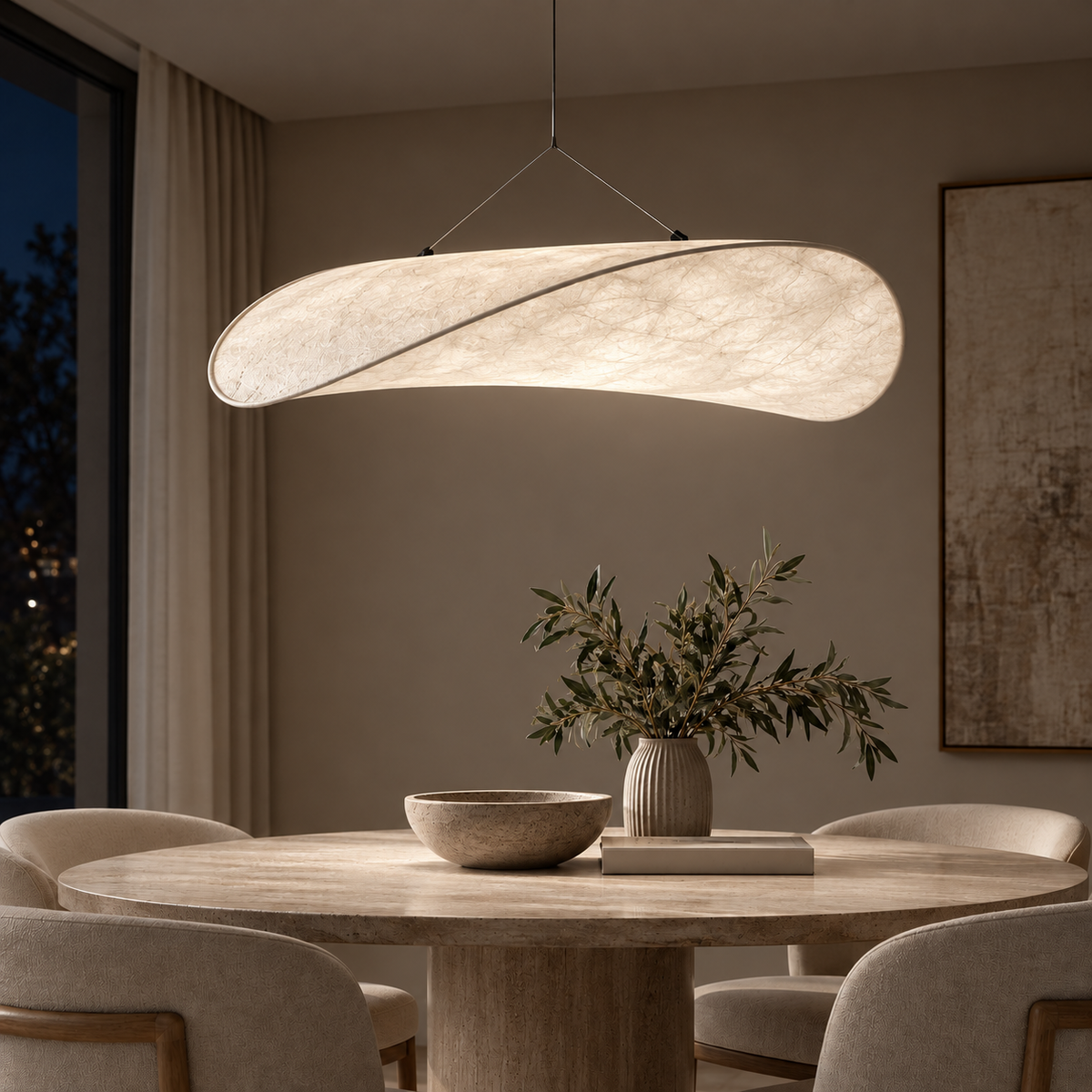 The same Onda pendant and dining room illuminated at night